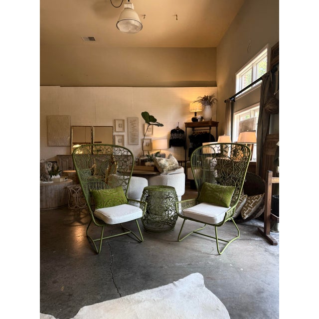 A striking vintage three-piece seating vignette featuring a pair of sculptural woven lounge chairs with a coordinating...