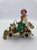 A charming vintage figural sculpture by celebrated California artist Ronald A. Lee, depicting a cheerful clown seated atop...