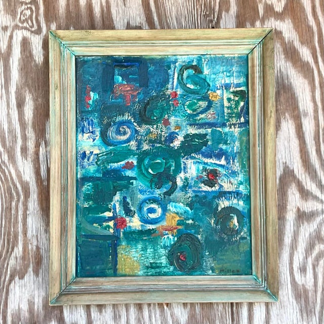 A stunning vintage MCM original oil painting. A chic abstract composition in brilliant shades of blue. Signed and dated by...