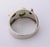 This eye-catching 1990s Sterling Cigar Band Ring with Green Gemstones is a great choice day and night. The simple band...