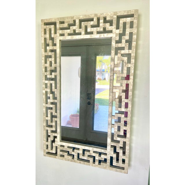 This Neiman Marcus Capiz Shell Mirror is a high-end, handcrafted piece, likely sourced through the luxury retailer's...