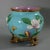George Jones Majolica cache pot which features magnolia blossom and two moths. Turquoise ground version. Colouration:...