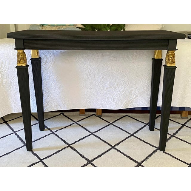 Neoclassical style pencil reed console with gilded details. Finished with black matte paint. No signed.
