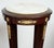 Pair of Napoleon III pedestals in mahogany featherbed with a marble top and gilded bronze inserts. The circular white...