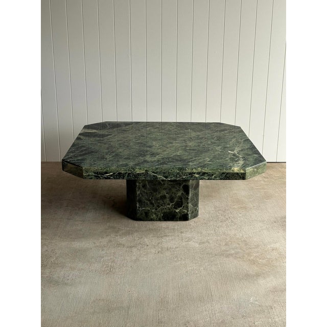 This vintage Italian coffee table is crafted entirely from richly veined Verde Alpi marble, pairing monumental proportions...