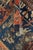 An unusual late 19th century Senneh antique rug having an architectural design of orange and blue panels containing...
