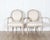 A refined pair of Gustavian style armchairs from Sweden, dating to the early 20th century and crafted in the neoclassical...