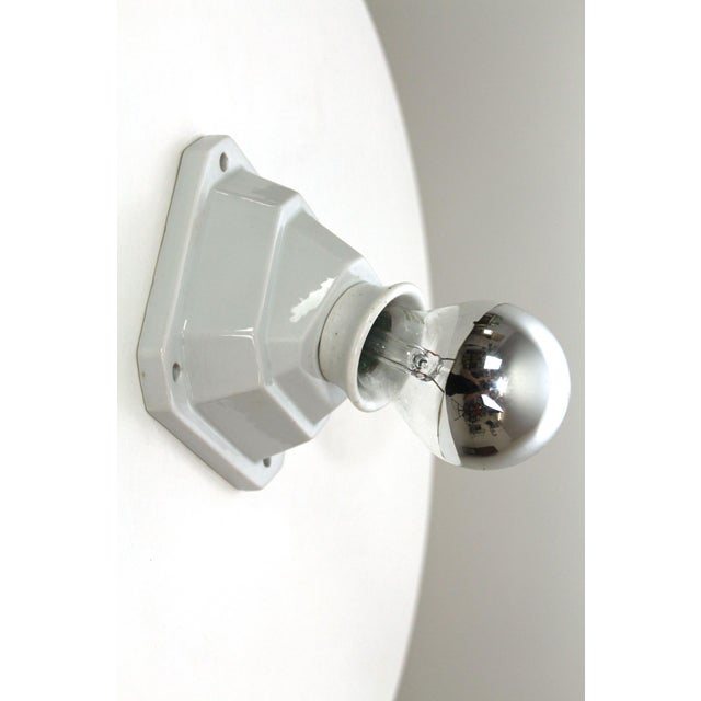 Porcelain wall lamp with optional wooden mounting plate, E27 socket This piece has an attribution mark, I am sure that it...