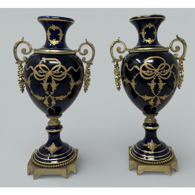 Stunning Pair of French Sevres Soft Paste Enameled Porcelain and Ormolu Twin Handle Table or Mantle Urns of traditional...