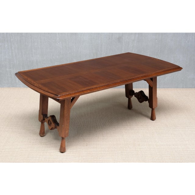 This very rare dining table was designed by Robert Guillerme and Jacques Chambron and produced by their company Votre...