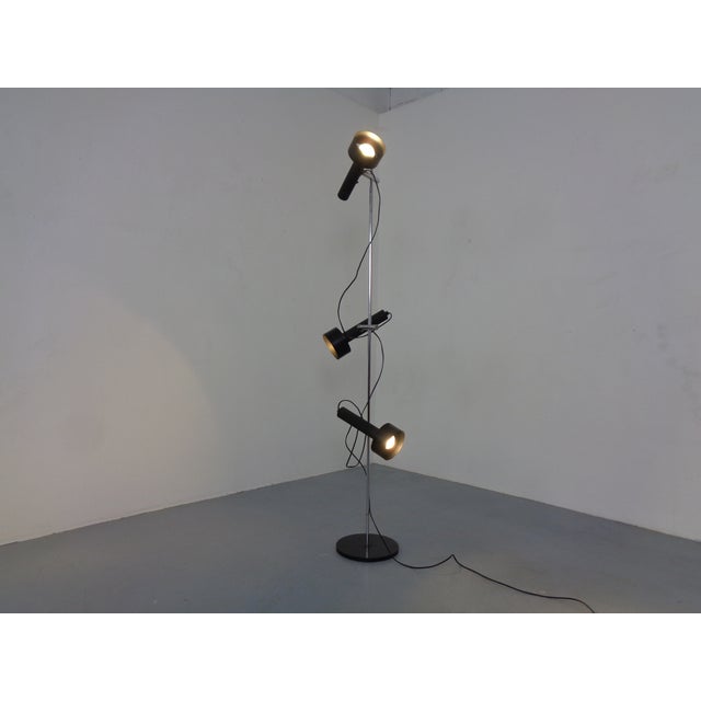 A minimalist floor lamp by Edi Franz for Swiss Lamps International from the 1960s, adjustable in angle and height. All...