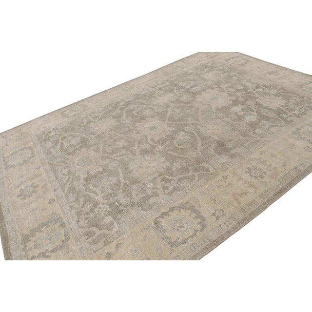 This 9x12 rug from the Modern Classics Collection by Rug & Kilim features gray and beige tones underscore floral patterns...