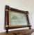 A mid-19th-century overmantle mirror in landscape form, the frame has classical columns to the sides, and top with gilt...
