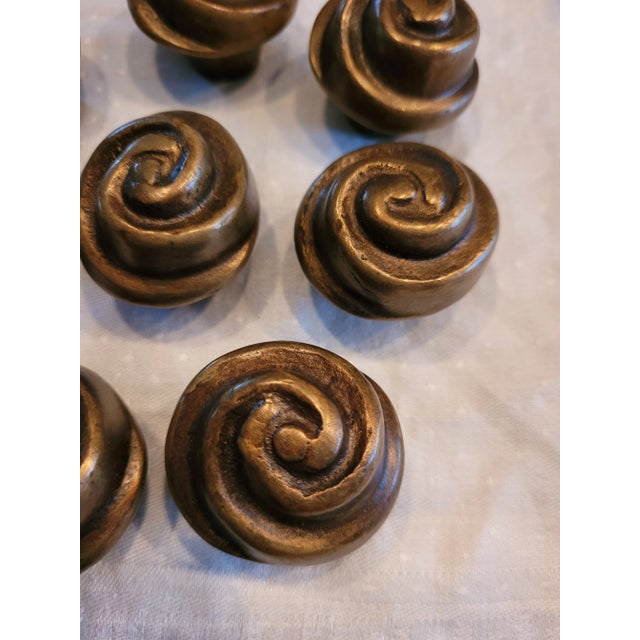 Heavy duty cast iron burnished bronze drawer pulls - Looks like a cinnamon cinnabon bun to me or a wrapped rose head -...