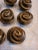 Heavy duty cast iron burnished bronze drawer pulls - Looks like a cinnamon cinnabon bun to me or a wrapped rose head -...