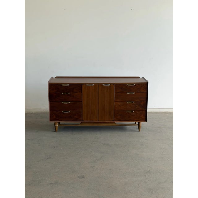 W60 D18.75 H32 A beautifully restored Broyhill Premier dresser showcasing the rich walnut grain and iconic mid-century...