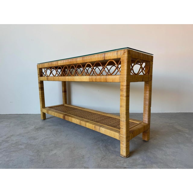 Charming and versatile, this vintage coastal rattan console table exudes natural warmth and organic elegance. Crafted from...