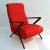 Elegant reclining armchair upholstered in red fabric with pronounced arm rests and frame in mahogany with nickel fittings....