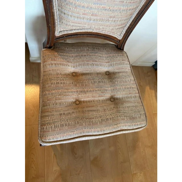Charming vintage French Provincial side chair featuring an elegant balloon-back silhouette, turned and fluted legs,...