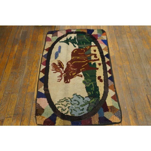 Antique American hooked rug. Size: 2'0" x 3'6".
