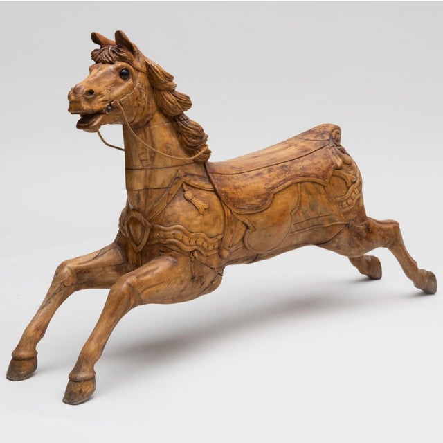 A beautifully carved antique Victorian pine carousel horse believed to have been manufactured by G. & J. Lines, a renowned...