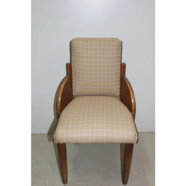 Suite 4 chairs 'bridge' blond walnut massif. They are based on round feet slightly tapered at the front and right feet to...