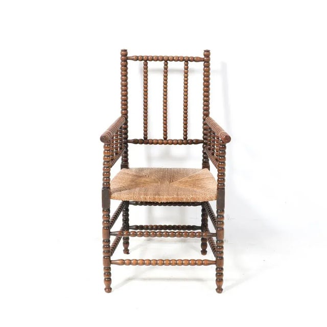 Stunning and rare Jacobean style bobbin armchair. Striking Dutch design from the 1900s. Solid hand-crafted stained beech...
