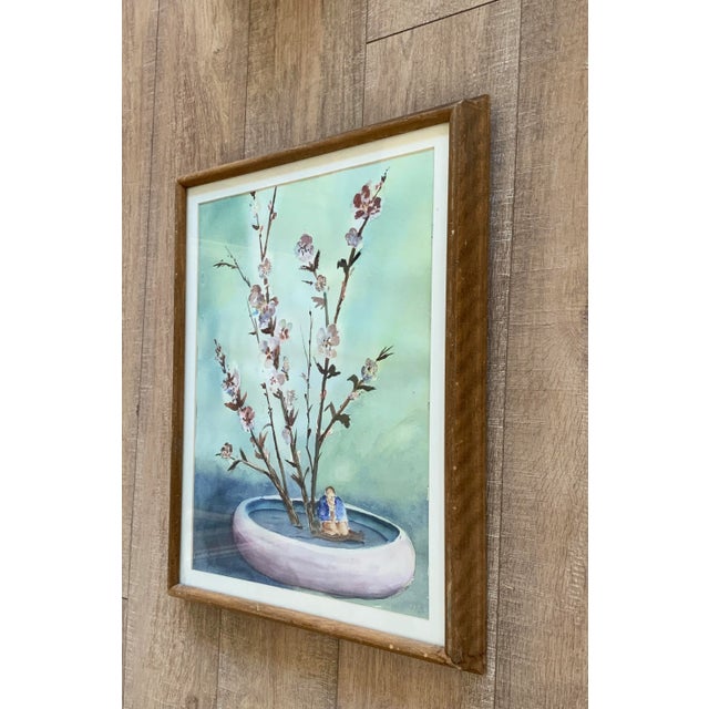 Soft serene framed vintage watercolor painting of cherry blossom branches. Aqua and lavender tones with pink blossoms in a...