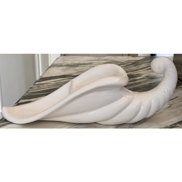Presenting a vintage ceramic handmade studio art cornucopia in a neutral creamy white glaze. A one-of-a-kind piece that...