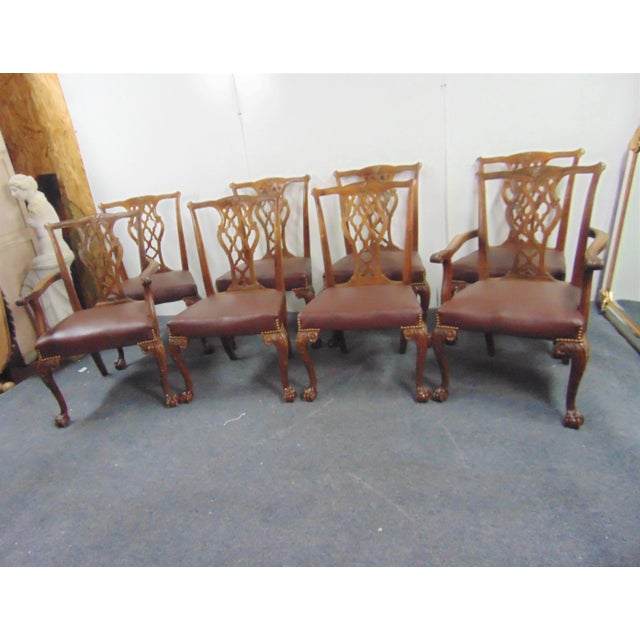 Set of 8 Chippendale style dining chairs, carved walnut frames, pierced carved slat with floral accents, claw & ball feet,...