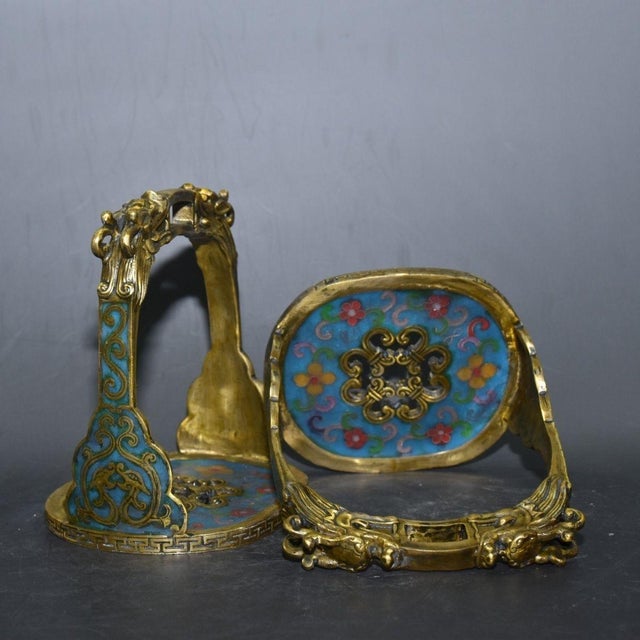This is a matched pair of impressive antique cloisonné enamel stirrups, traditionally used for horseback riding and often...