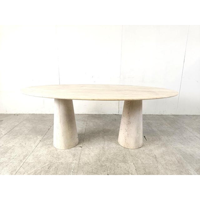 Elegant travertine dining table with two conical pedestal bases. Beautiful coloured travertine with lovely pattern....
