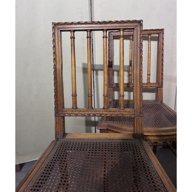 Set of four Louis XVI style carved wood chairs cane seats slatted backs tapered legs