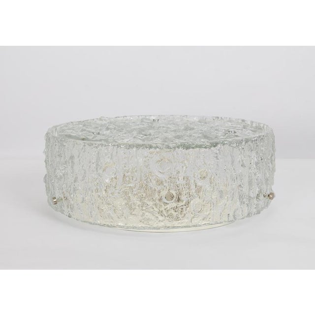 Gorgeous two-part drum-shaped flush mount chandelier with one ring outside and a flat disc made of heavy textured clear...