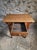 A compact French work table with a matching bistro chair. The table dates from around 1900 and is made of pine and poplar....