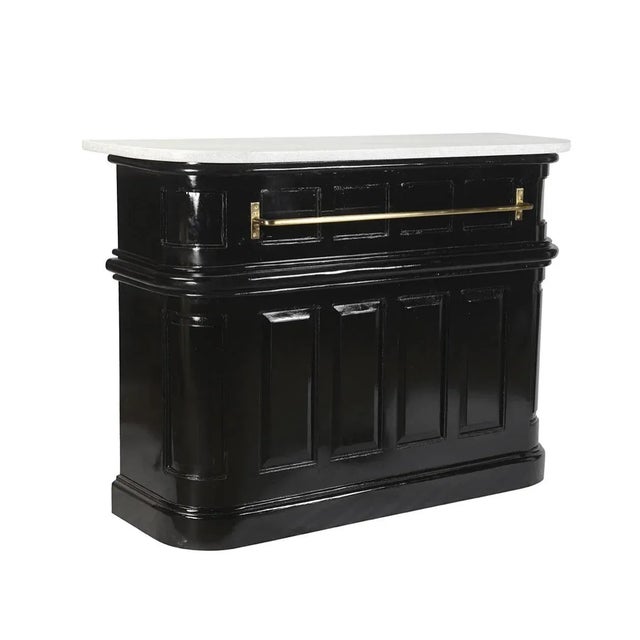 The black-and-white Torino Bar takes its inspiration from classic English pubs. The wood base is simply but decoratively...