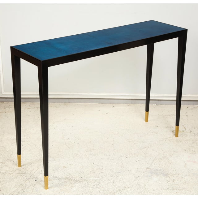 Bespoke Ebonized Console With Blue Parchment Top on Tapered Legs ending in brass sabots. It can be made to order with your...