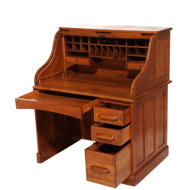 Antique Oak S-Roll Top Single Pedestal Desk C1910 Measures - 48.75"H x 41.75"W x 29.75"D This antique oak roll top desk,...