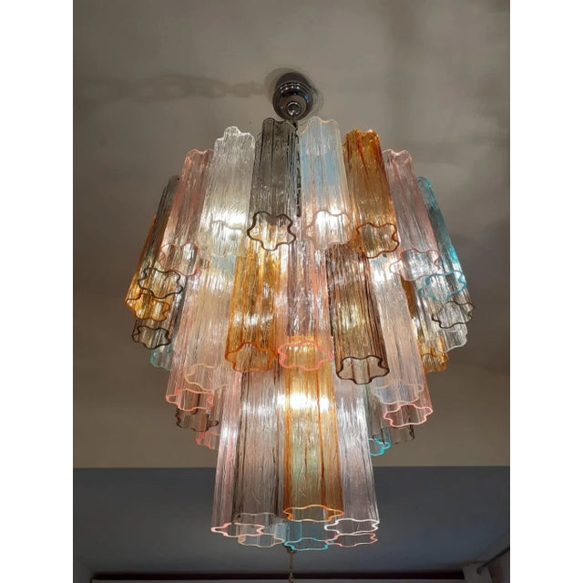 Contemporary Murano Glass "Tronchi" chandelier with a chrome metal frame and very rare multicolor Murano glass. Spare...