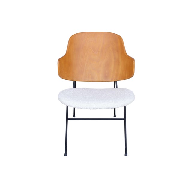A Mid Century Modern Penguin lounge chair designed by Danish furniture designer Ib Kofod-Larsen (1921-2003). The iconic...