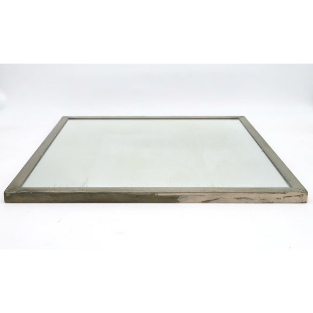 Vintage square bathroom wall mirror with a steel frame. Mild scratching on the glass and some corrosion on the frame,...