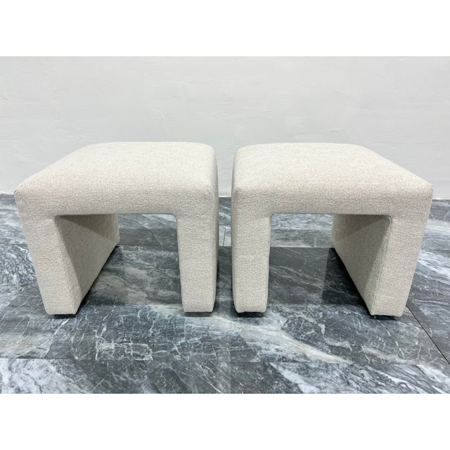 Pair of newly upholstered waterfall stools with natural linen and poly blend high end fabric. Stools are original from the...