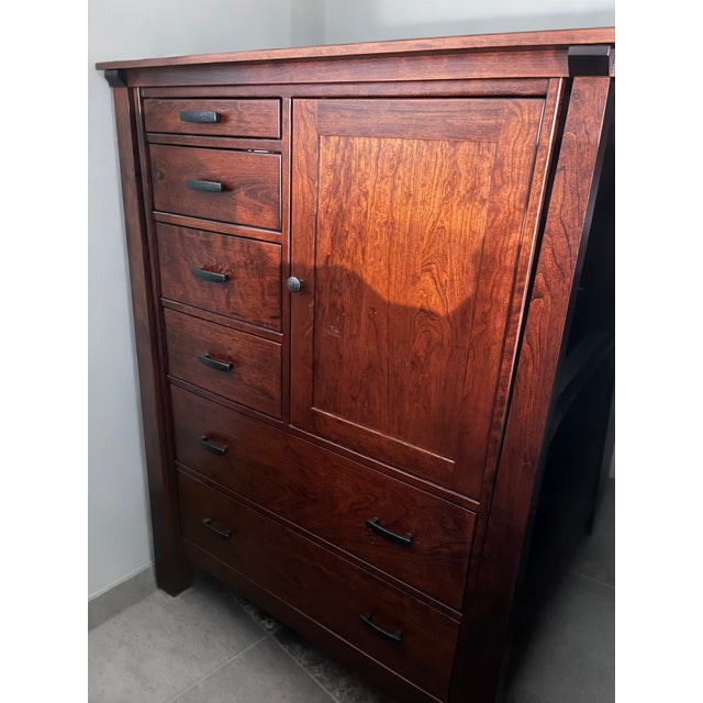 this piece is amish made. the wood is rustic cherry hardwood. it is roughly 3 years old. purchase price was around 2,000...