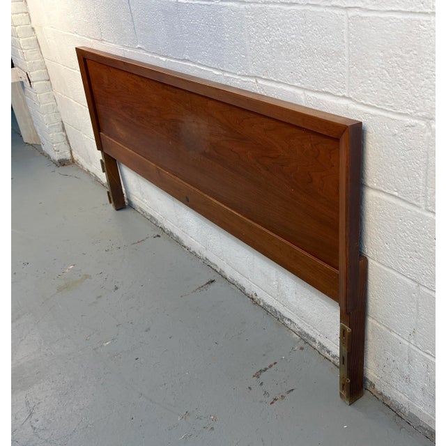 Elegant mid-century modern walnut headboard designed by John Stuart. Showcasing the brand’s signature craftsmanship, it...