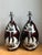 This elegant pair of vintage ceramic table lamps embodies the timeless appeal of mid-century decorative lighting. Each...
