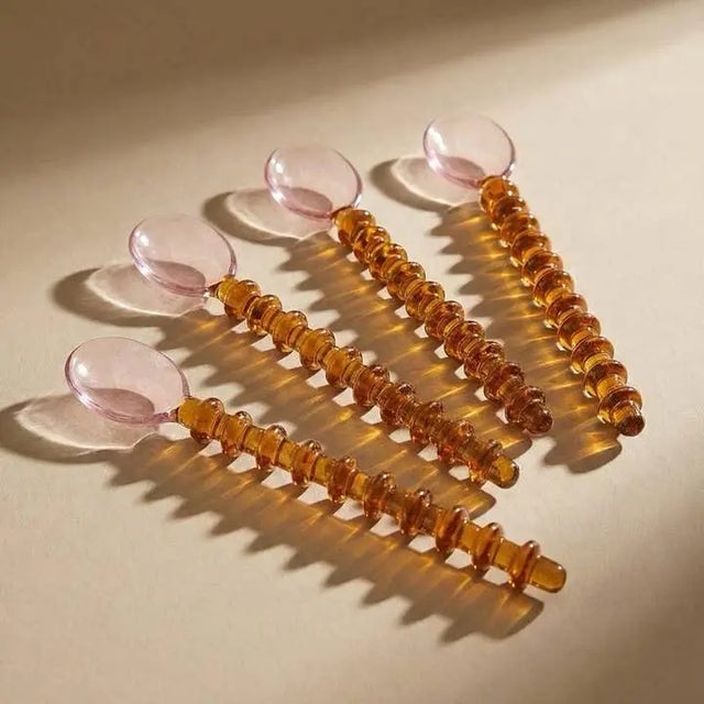 Pale Pink / Amber Beaded Stem Entirely made out of glass Size: 7.5"L x 1"W Brand new in box Set of 4