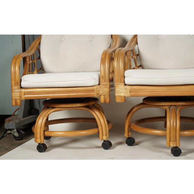 Wood Set of Four Vintage Coastal Rattan Swivel Lounge Chairs on Casters With Original Cushions For Sale - Image 7 of 7