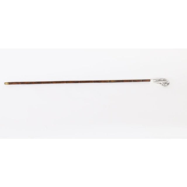 This is a beautiful antique sterling silver swan head handle walking cane bearing hallmarks with the makers mark CHD and...