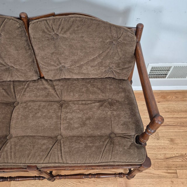 This is a vintage French country style walnut settee or bench with brown faux suede cushions. It is small in scale, so it...
