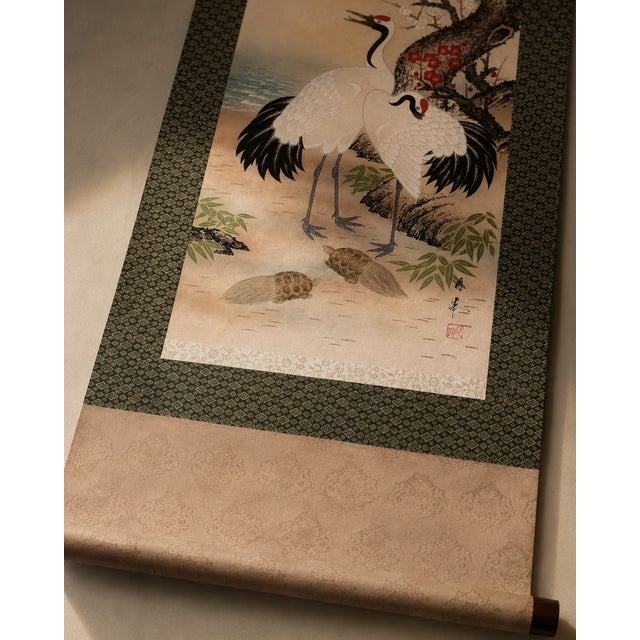 A refined vintage Japanese kakejiku hanging scroll featuring an auspicious composition of cranes, turtles, pine, plum...